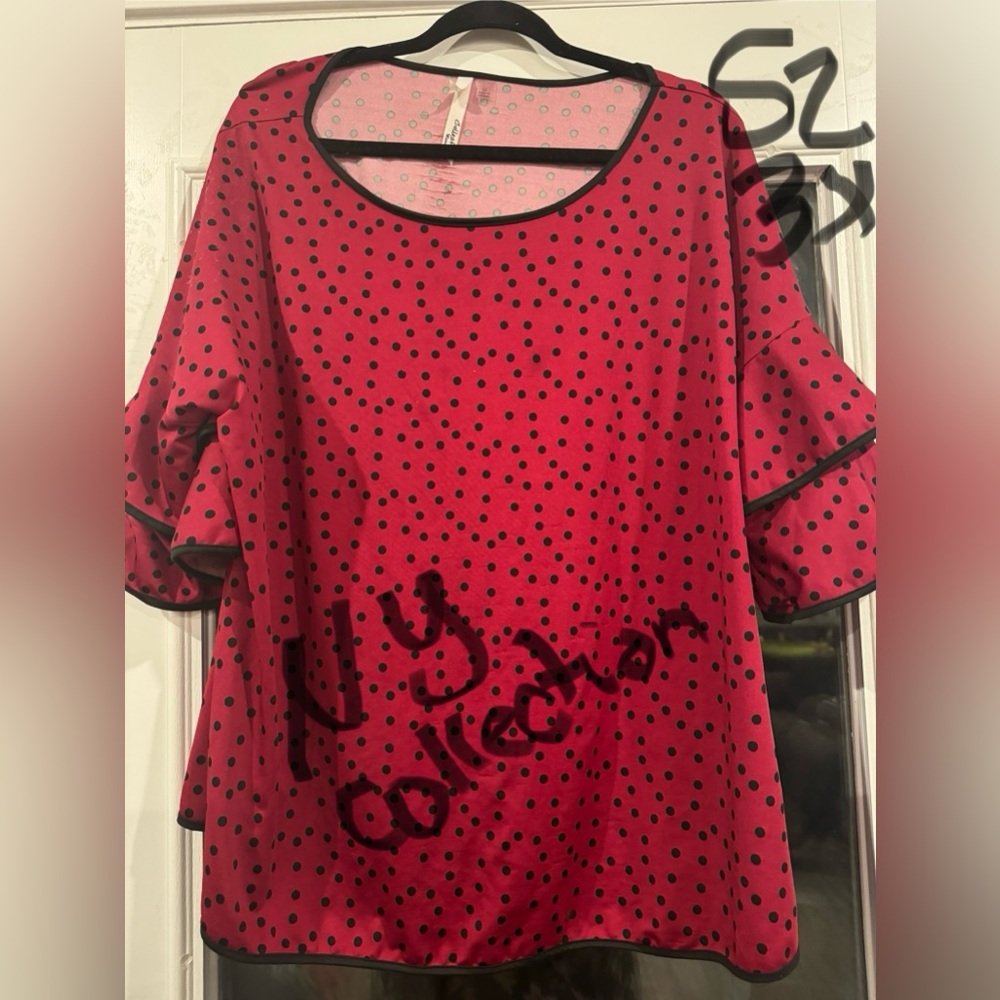 Beautiful polka dot top with 3/4 length ruffle sleeve.